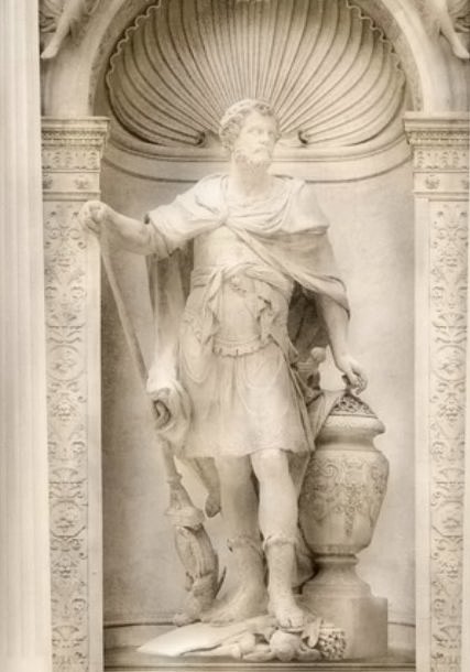 Statue of a bearded man in Roman armour, in a shell niche of our wallpaper